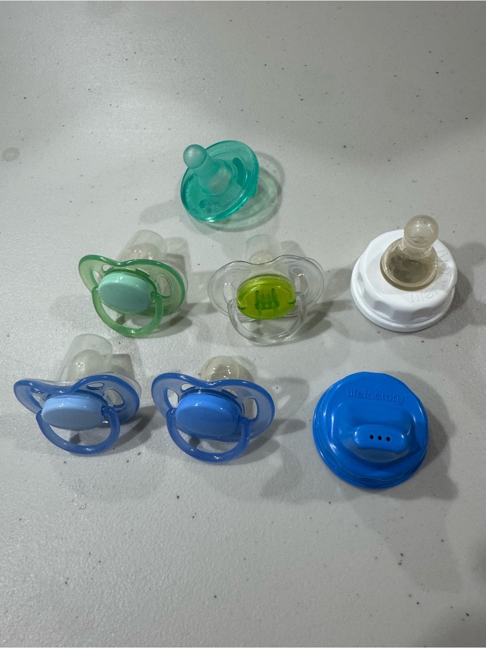 Life factory bottle tops and pacifiers